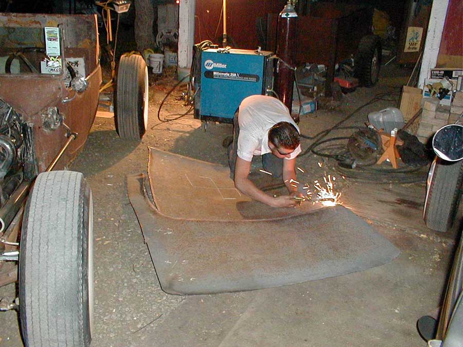 Recycling the old top off my car for the top on Brian's car.