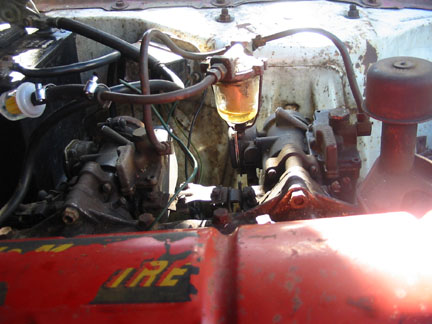 Big funky old fuel filter, new disposable in-line filter