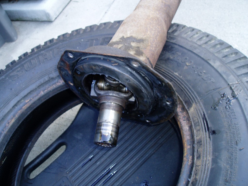 Sat 4/8/06.  Torque tube rubber trunion. This is a big rubber donut that apparently helps driving stability.