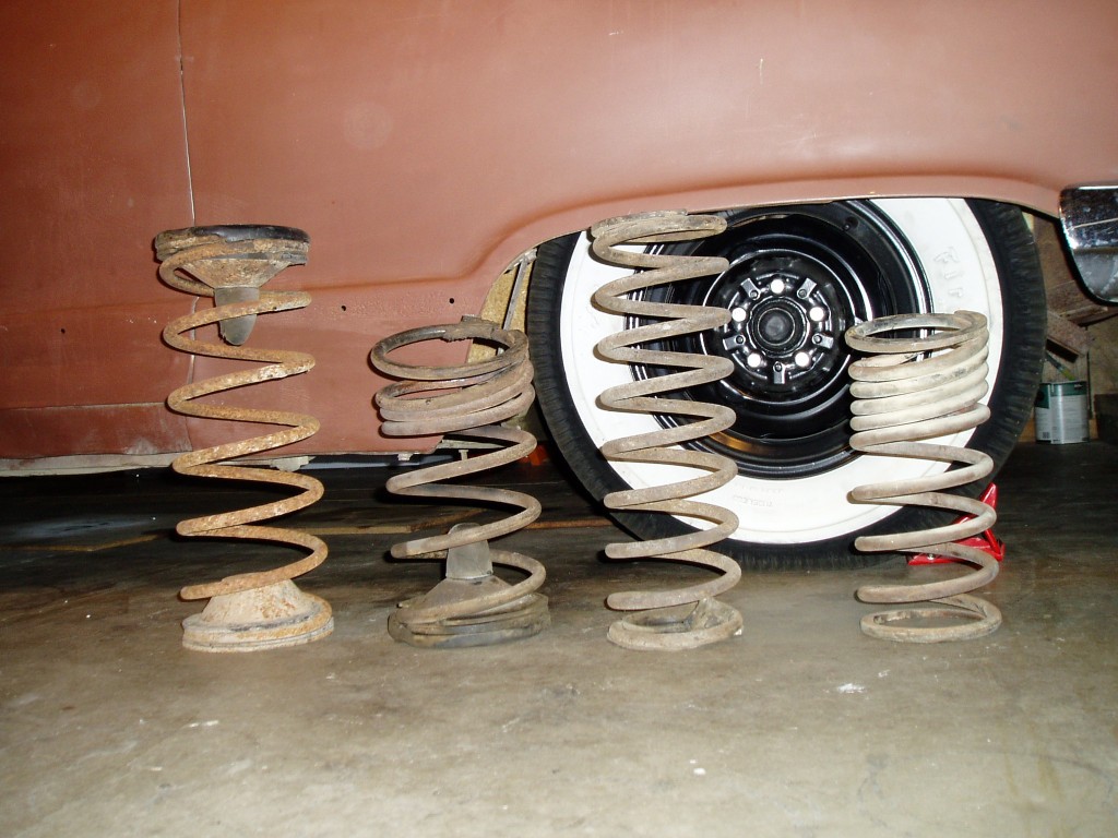 Springs left-to-right: stock front, shortened front, stock rear, shortened rear. Shortening done with a oxy-acetylene last sprin