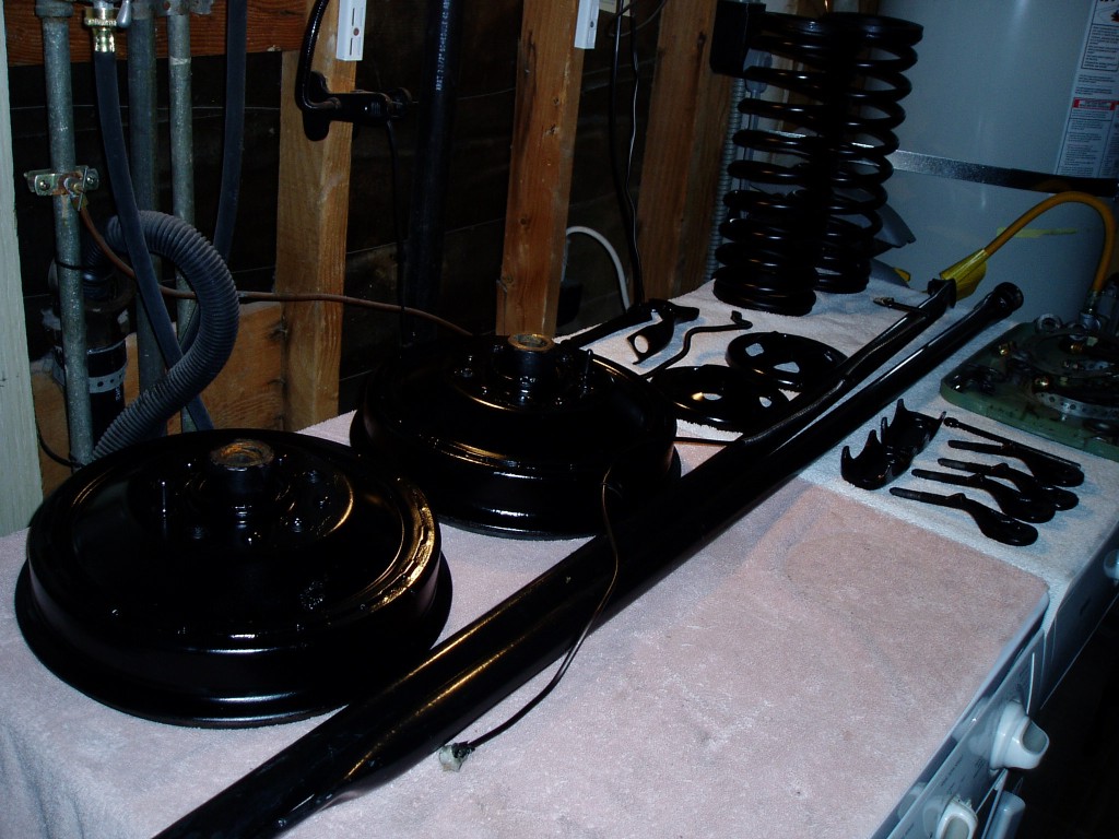 Clean rear-end parts. I clean and re-painted the rear hubs, spring mount hardware, brake lines, and stabilizer bars.