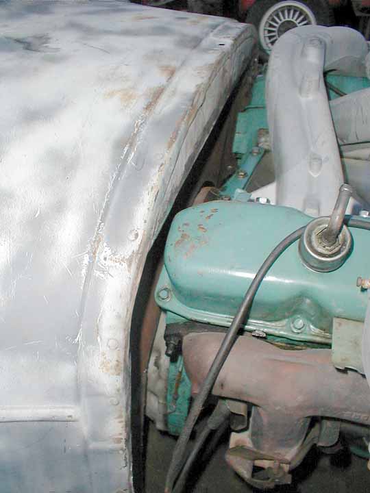 The firewall used to be the back of the front seat in the original car that they'd tie the upholstery to.