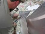 The front edge is folded over, so I can now cut the rest.
