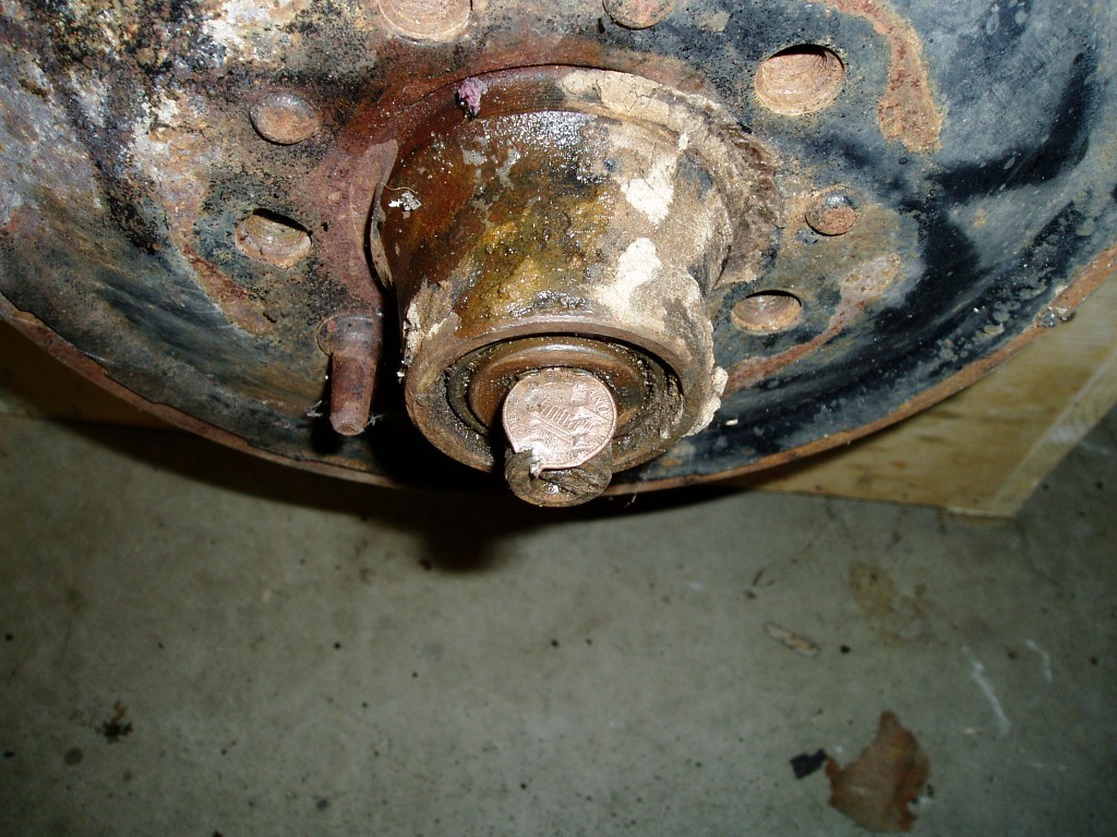 Grandpa soldered a penny onto the spindle when he lost the castellated nut. I'm glad I wasn't driving around the same town back 