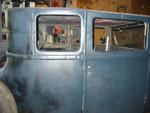 Grinding off the tack welds. The doors were never finished, just tack welded in place. Even the front & back were done just 