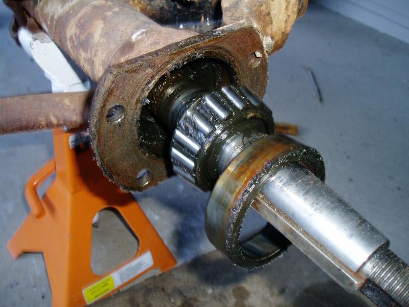 The driver side rear axle. The shaft is tapered, with a woodruff key (the notch).