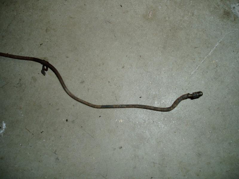 Rear brake hose, rusted.
