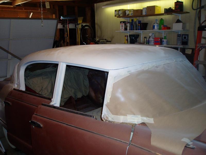 Sunday 5/20/2007. White primer is finally on the roof.