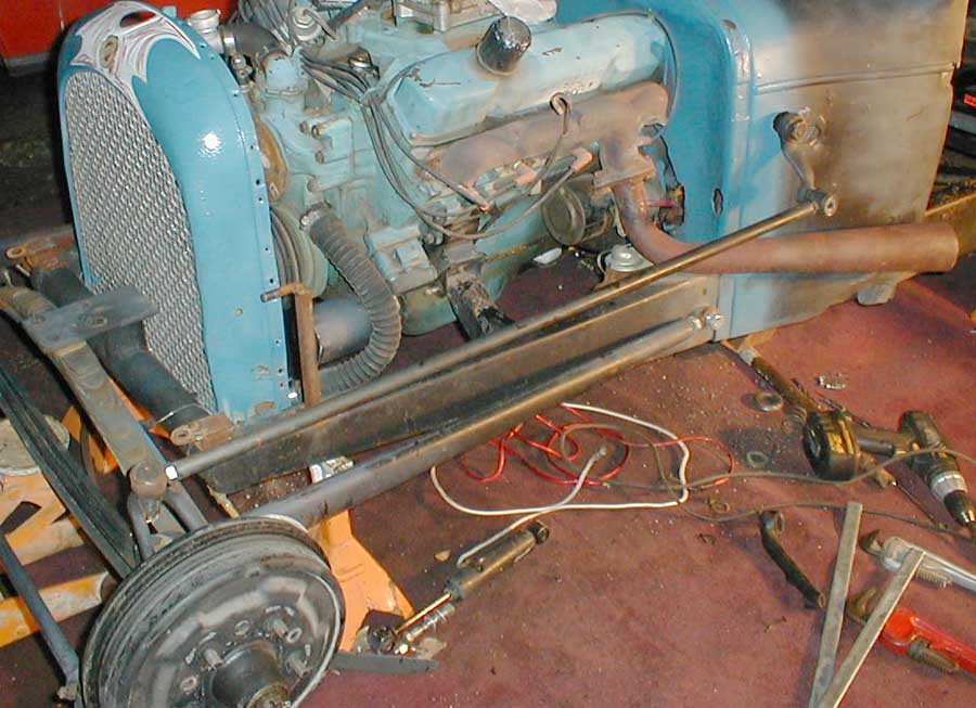 With the steering box temporarily hung.
Box is more forward and up.
Linkage is more parallel.
I'm looking at about two turns 