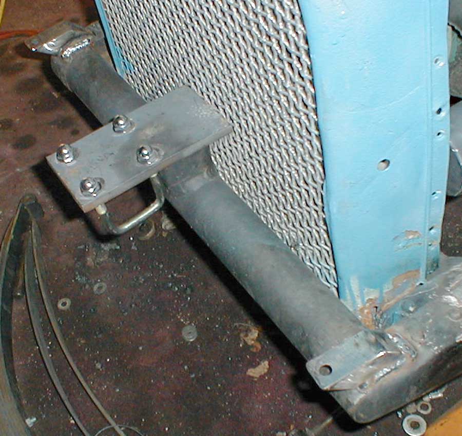 New headlight perches.
This is tough real-estate.
The bigass headlights, steering, radius rods, shocks, radiator shell, and sp