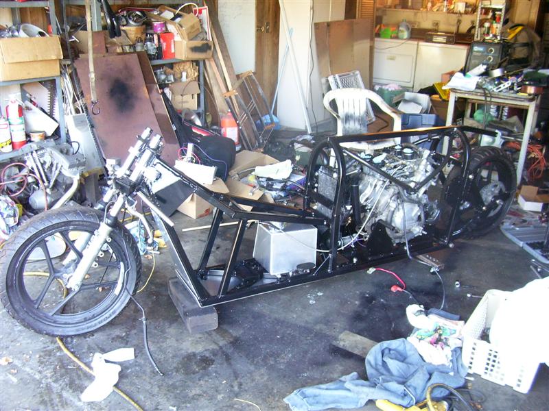 Engine support brackets mounted, along with fuel lines and bracket for the rectifier. Front exhaust on, just to make sure I have