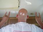 Mojo shaves his head. Ouch.