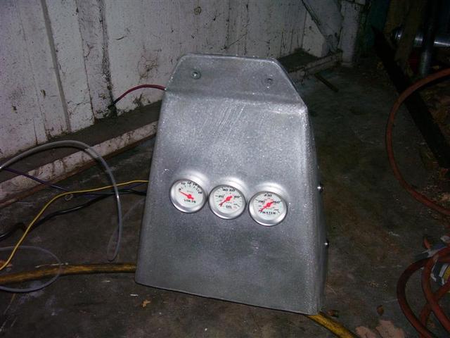 Dash panel, top. Not that I can see the gauges when I'm racing, but they will help during warm-up.