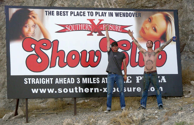 Photo shoot with a billboard advertising TättMätt's sponsor.