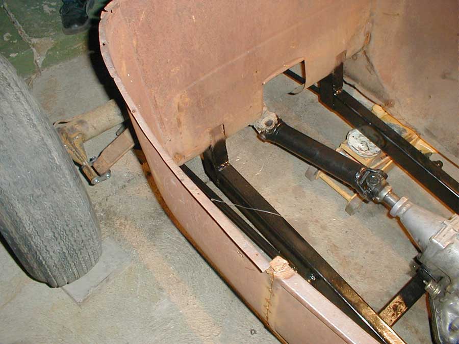 Driveshaft arrives and gets installed.
Notice the new frame paint.